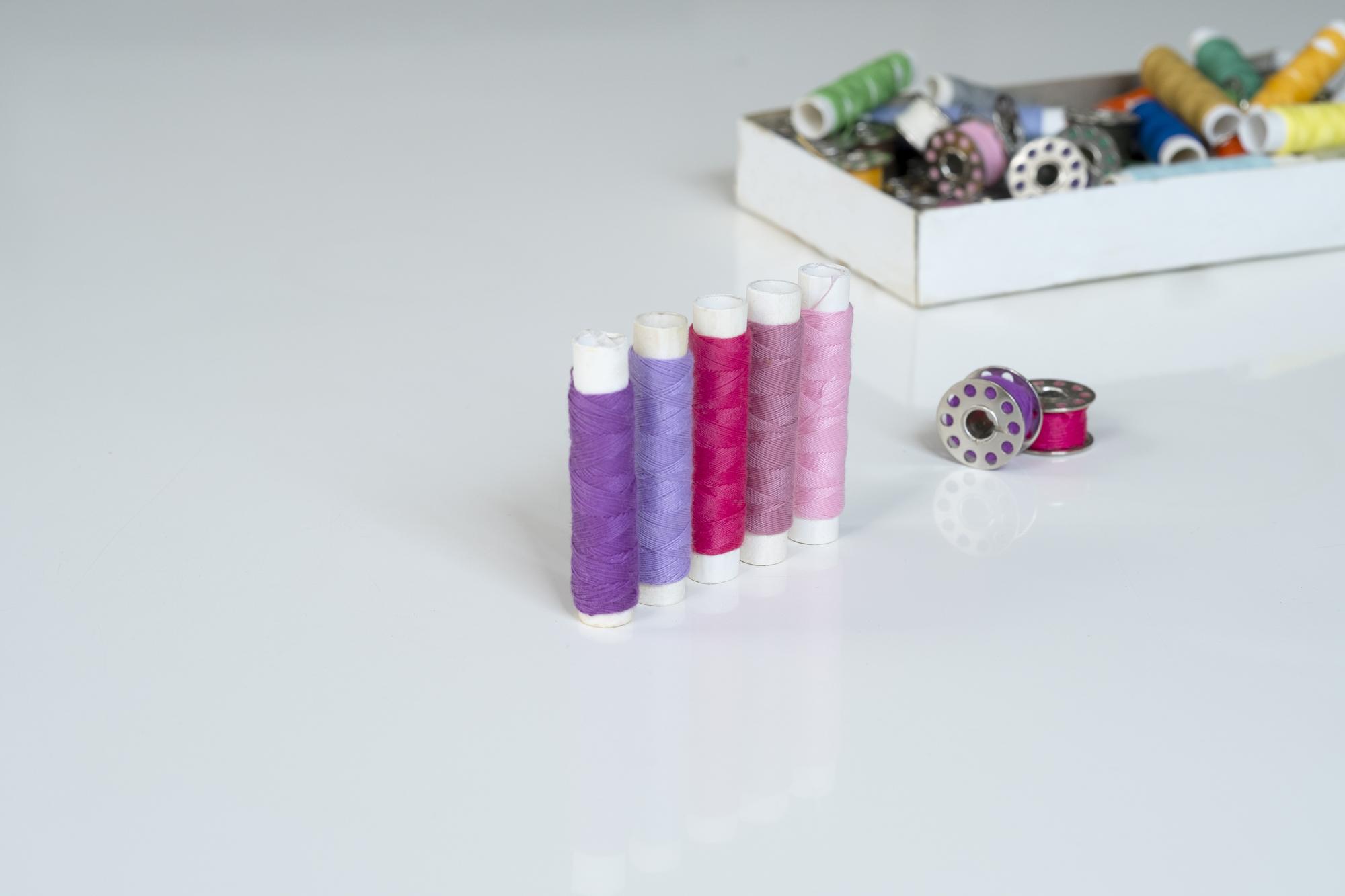 arrangement of embroidered samples on table